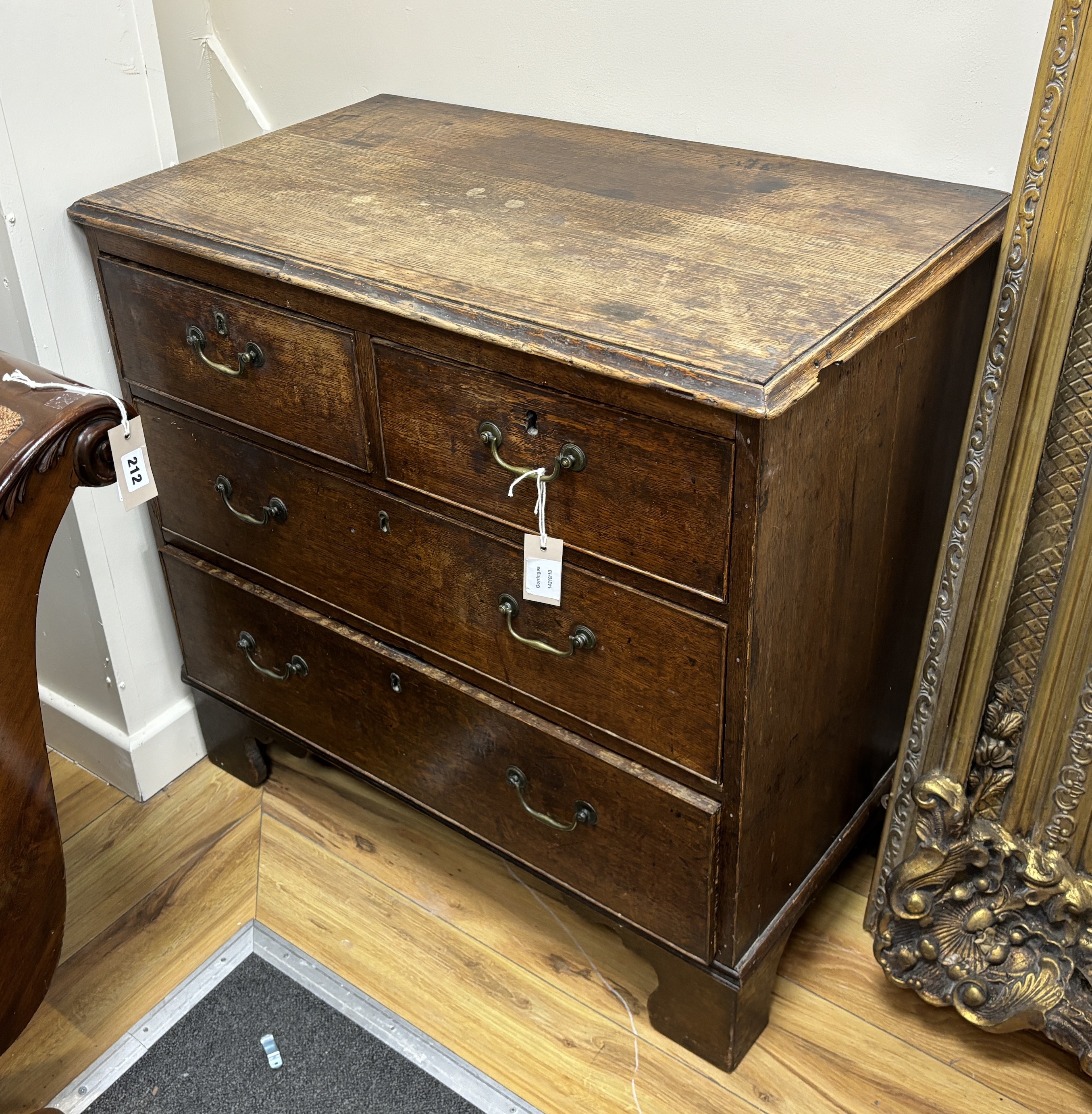 A small George III oak chest of four drawers, width 84cm, depth 49cm, height 79cm